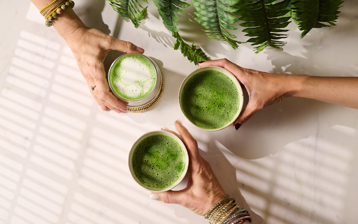 Three mugs of matcha tea and matcha latte from above