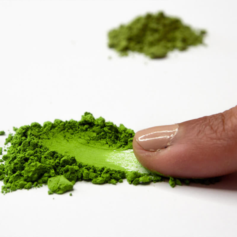 testing matcha tea powder with finger